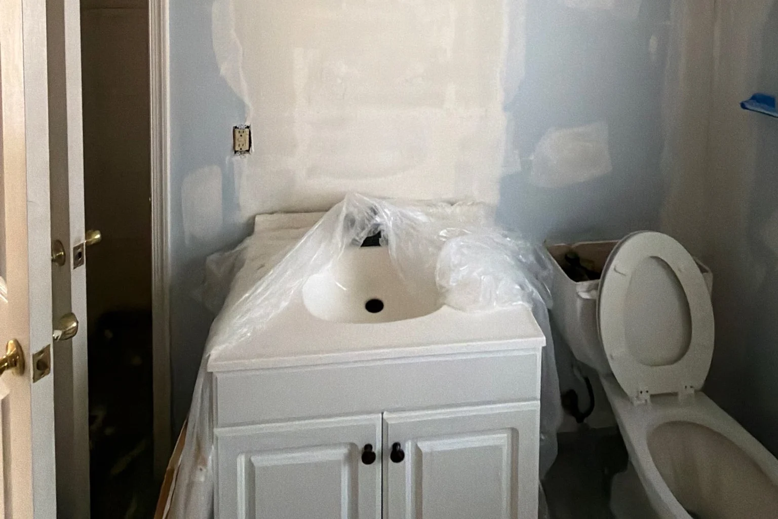 Bathroom vanity and toilet during interior remodeling work